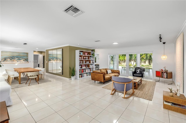 living room with ornamental molding, light tile patterned flooring, visible vents, and recessed lighting