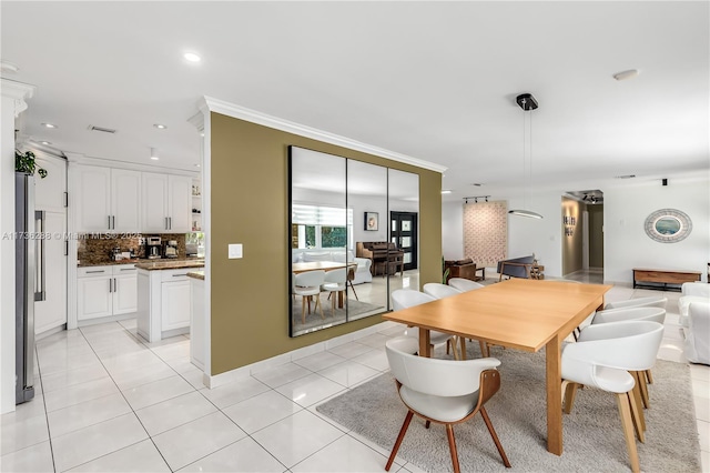 dining space featuring recessed lighting, visible vents, crown molding, and light tile patterned flooring