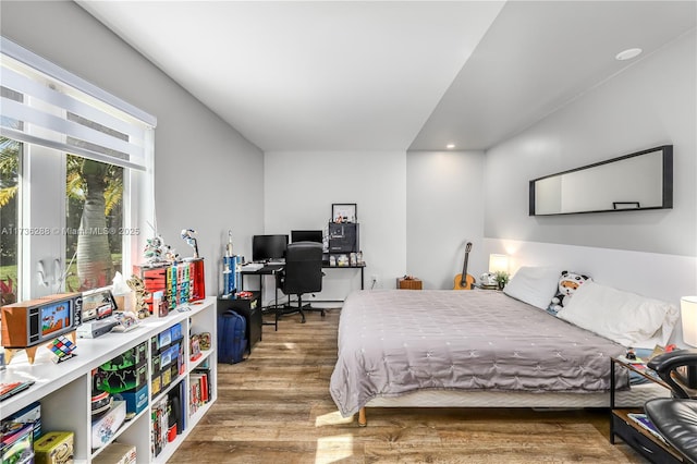 bedroom with wood finished floors