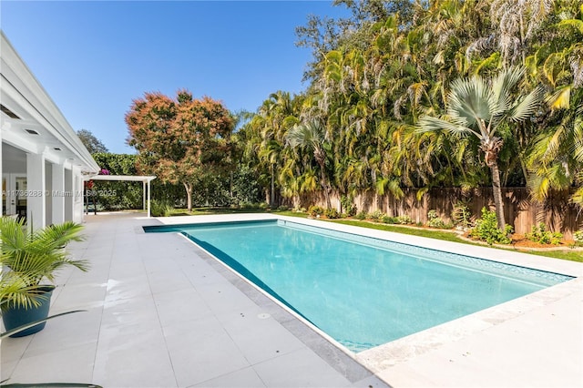 view of pool with a patio area, fence, and a fenced in pool