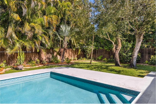 view of pool with a fenced backyard, a fenced in pool, and a yard