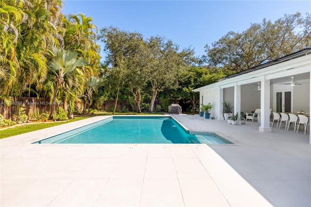 view of swimming pool with a fenced in pool, french doors, a patio area, and a fenced backyard