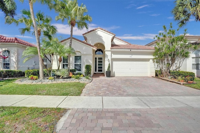 mediterranean / spanish-style home featuring a garage