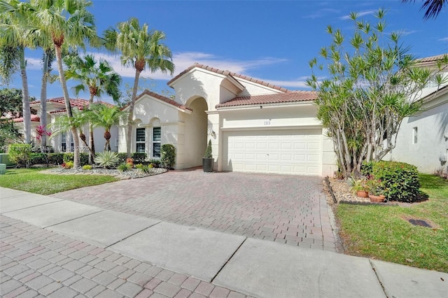 mediterranean / spanish-style home featuring a garage