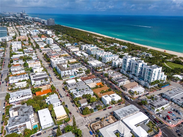 bird's eye view with a view of the beach and a water view