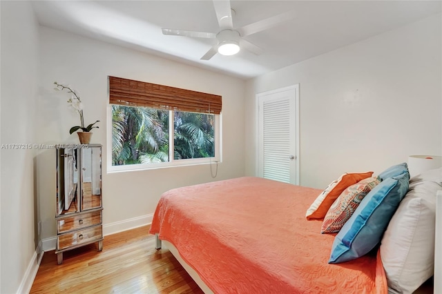 bedroom with ceiling fan and light wood-type flooring