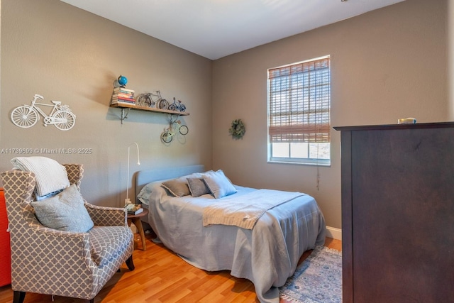 bedroom with wood-type flooring