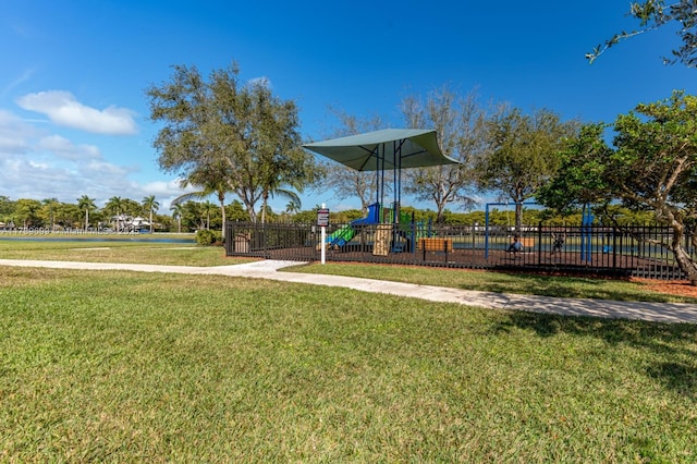 view of jungle gym featuring a lawn