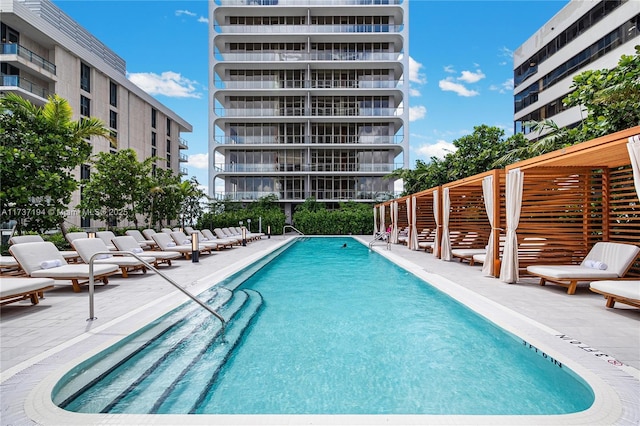 view of swimming pool featuring a patio area