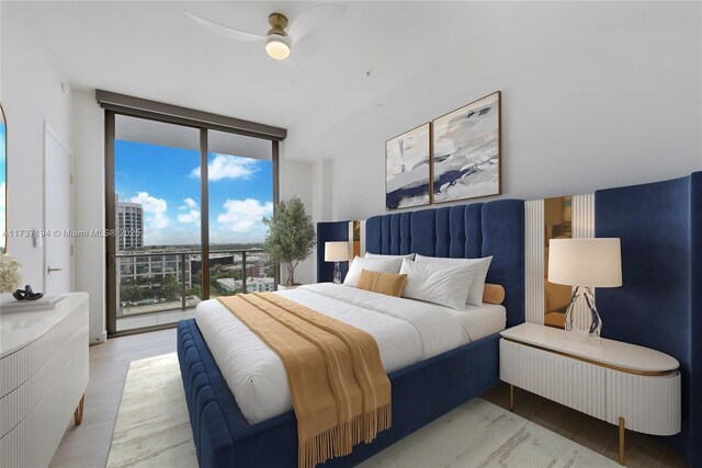 bedroom featuring ceiling fan, a wall of windows, access to exterior, and light hardwood / wood-style flooring