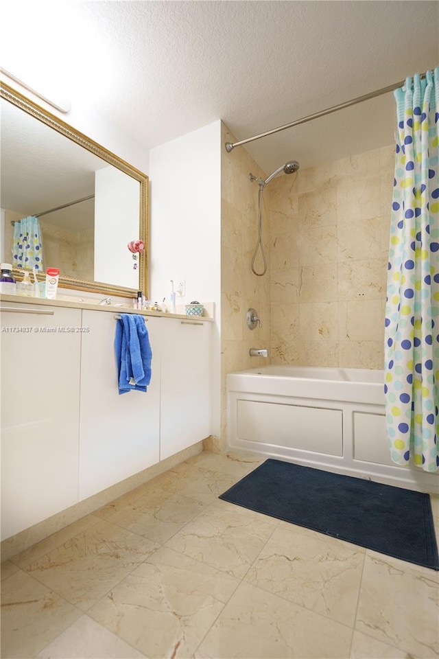 bathroom featuring shower / bathtub combination with curtain and a textured ceiling