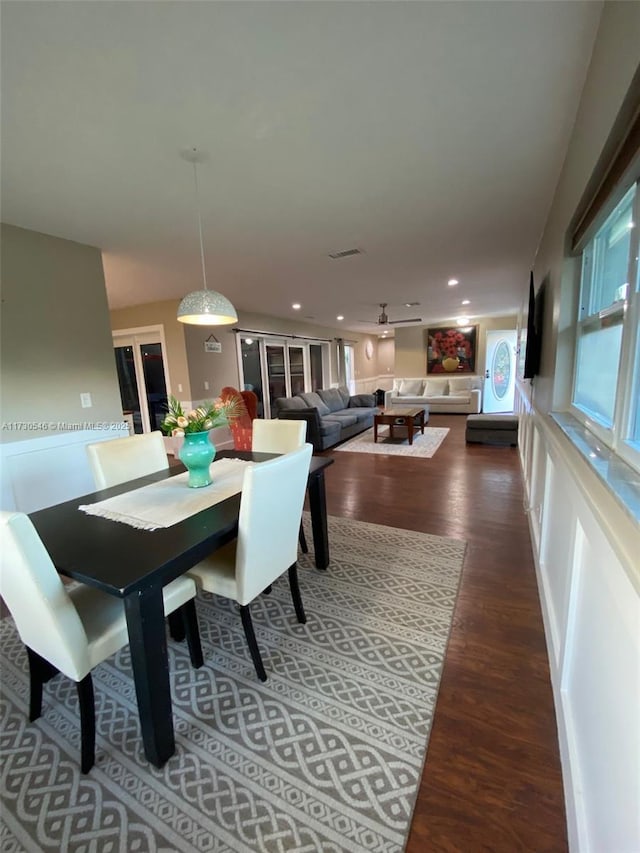 dining space featuring dark hardwood / wood-style flooring