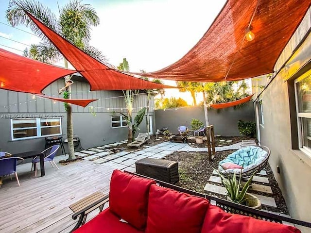 wooden terrace featuring an outdoor hangout area