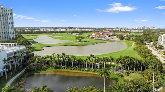 birds eye view of property with a view of city, golf course view, and a water view