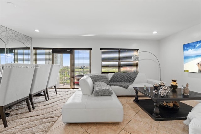 living area featuring recessed lighting and light tile patterned flooring