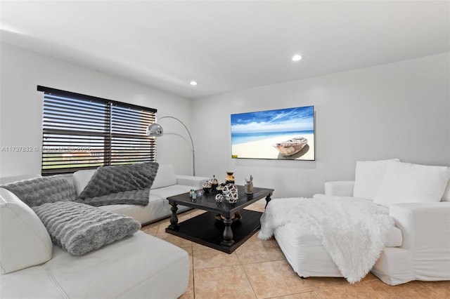 living room with recessed lighting and light tile patterned flooring