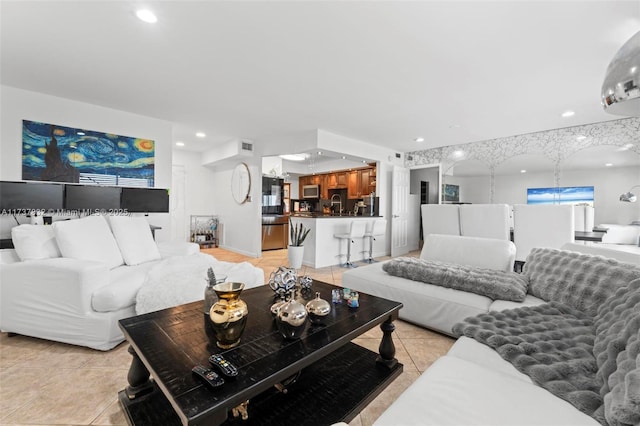 living room featuring recessed lighting, visible vents, and light tile patterned floors