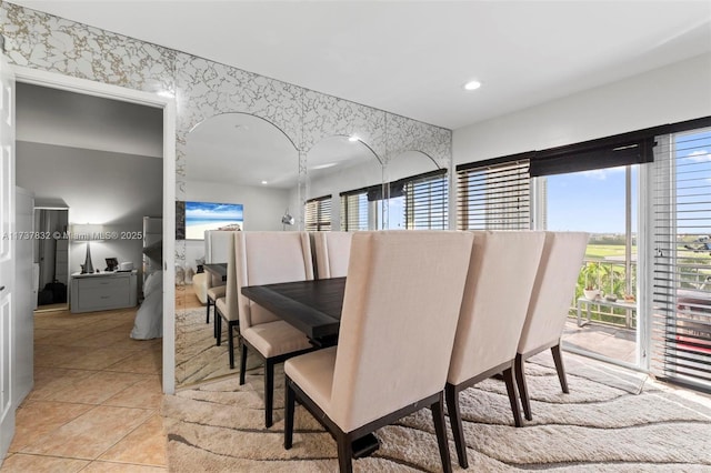 dining area with light tile patterned floors, wallpapered walls, and recessed lighting