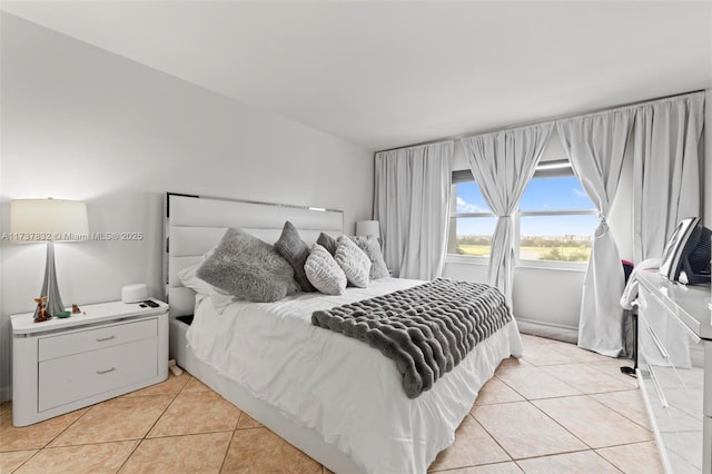 bedroom featuring light tile patterned floors