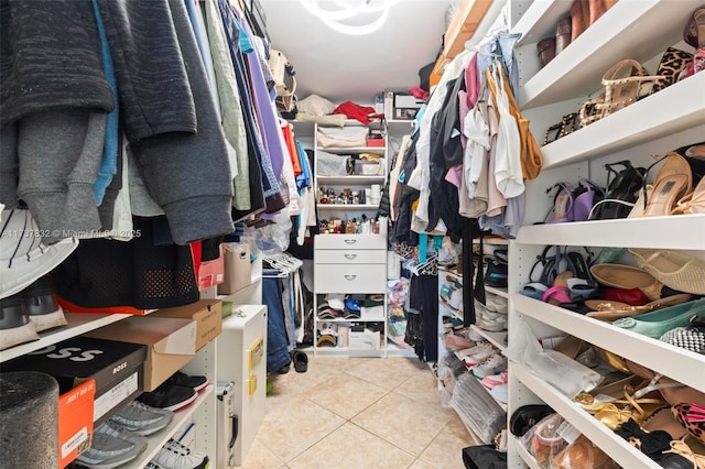 walk in closet featuring light tile patterned floors