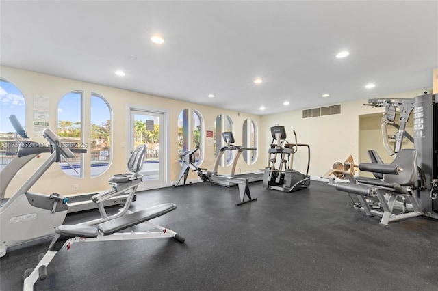 workout area featuring visible vents and recessed lighting