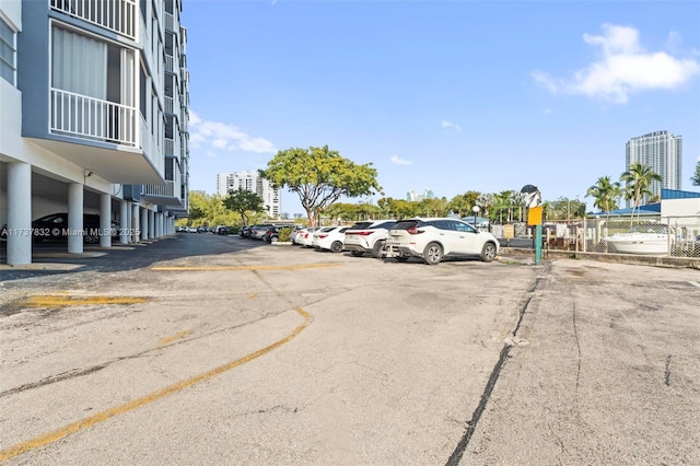 uncovered parking lot with a view of city