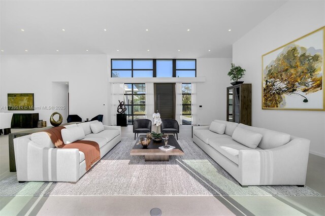 living room featuring a high ceiling