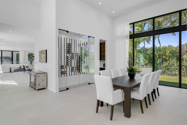 dining area featuring a high ceiling