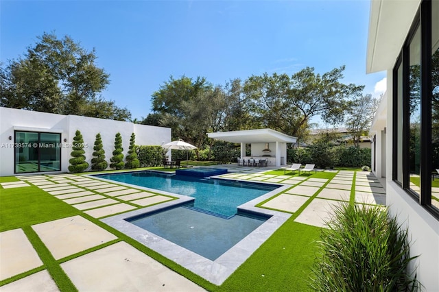 view of pool featuring a patio area and an outdoor bar