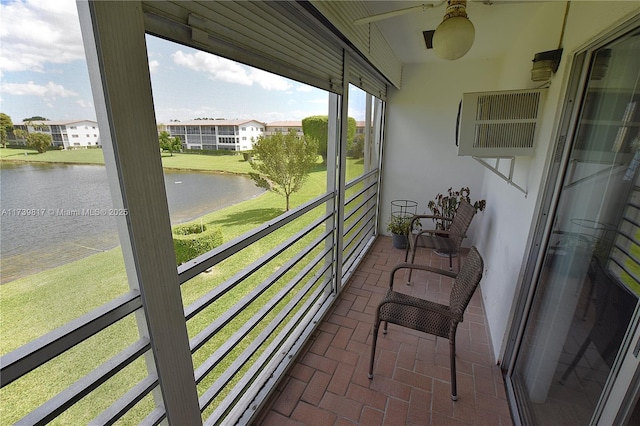 balcony featuring a water view