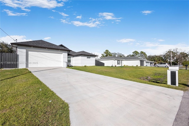 view of front of property featuring a garage and a front yard