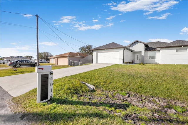 single story home featuring a garage and a front yard