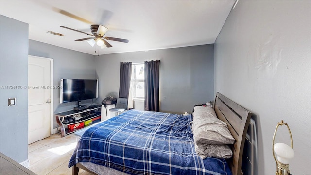 bedroom with light tile patterned floors and a ceiling fan