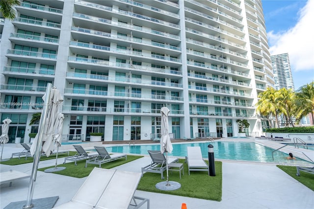 view of swimming pool with a patio area