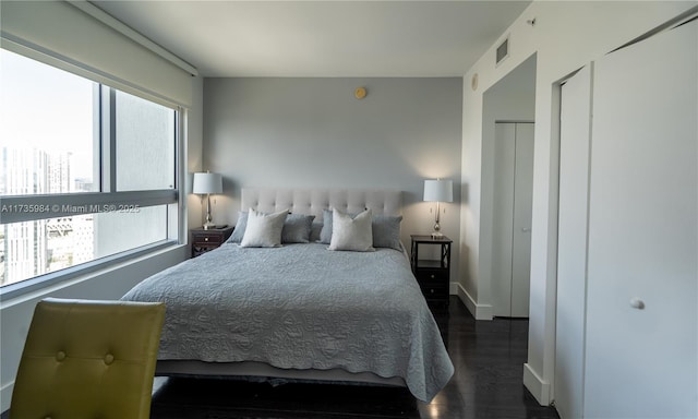 bedroom featuring dark hardwood / wood-style floors