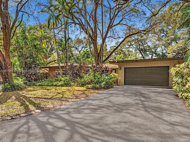 view of front of home with driveway and an attached garage