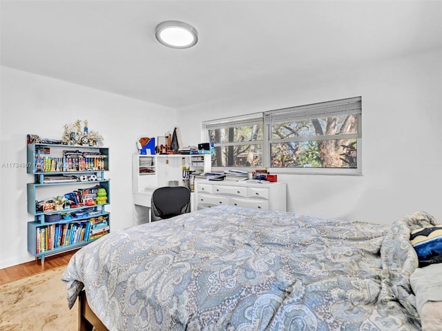 bedroom with wood finished floors