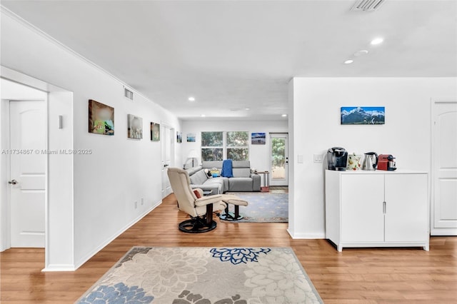 interior space with light wood-style floors, visible vents, and recessed lighting