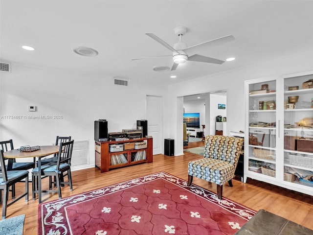 living room featuring recessed lighting, visible vents, ceiling fan, and wood finished floors