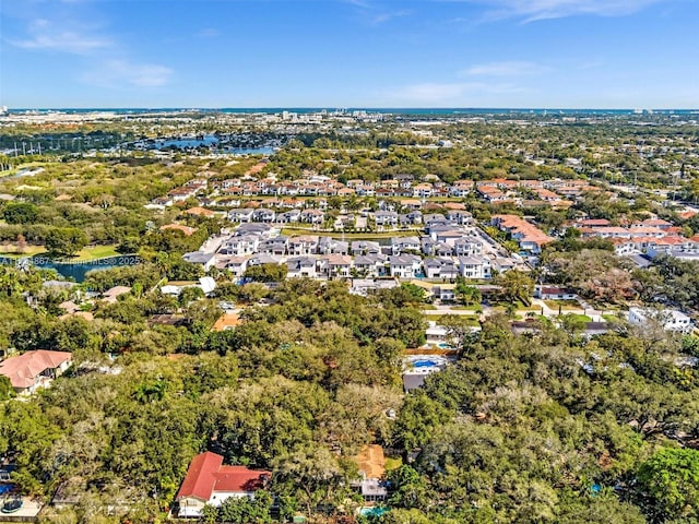 bird's eye view featuring a water view and a residential view