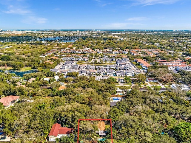 birds eye view of property with a water view and a residential view