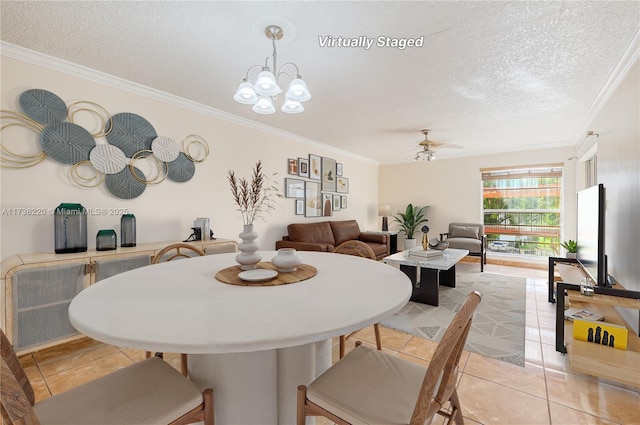 tiled dining area featuring ornamental molding, ceiling fan with notable chandelier, and a textured ceiling