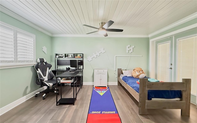 bedroom featuring crown molding, hardwood / wood-style floors, and wooden ceiling