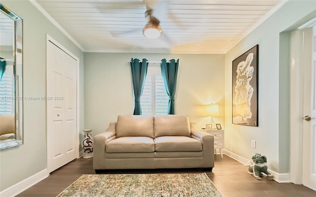 living area with ornamental molding and dark hardwood / wood-style floors