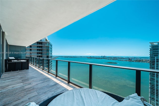 balcony featuring a water view