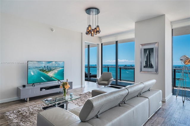 living room with an inviting chandelier and hardwood / wood-style floors