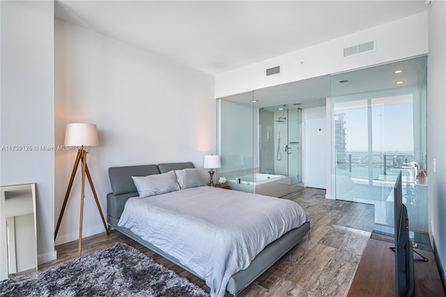 bedroom featuring baseboards, visible vents, and dark wood-style flooring