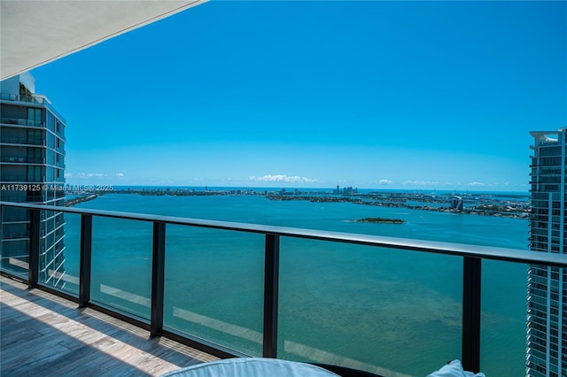 balcony featuring a water view