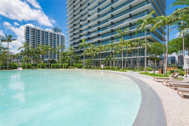 view of swimming pool with a view of city