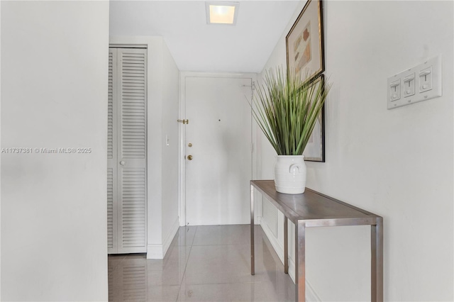 hall featuring tile patterned floors